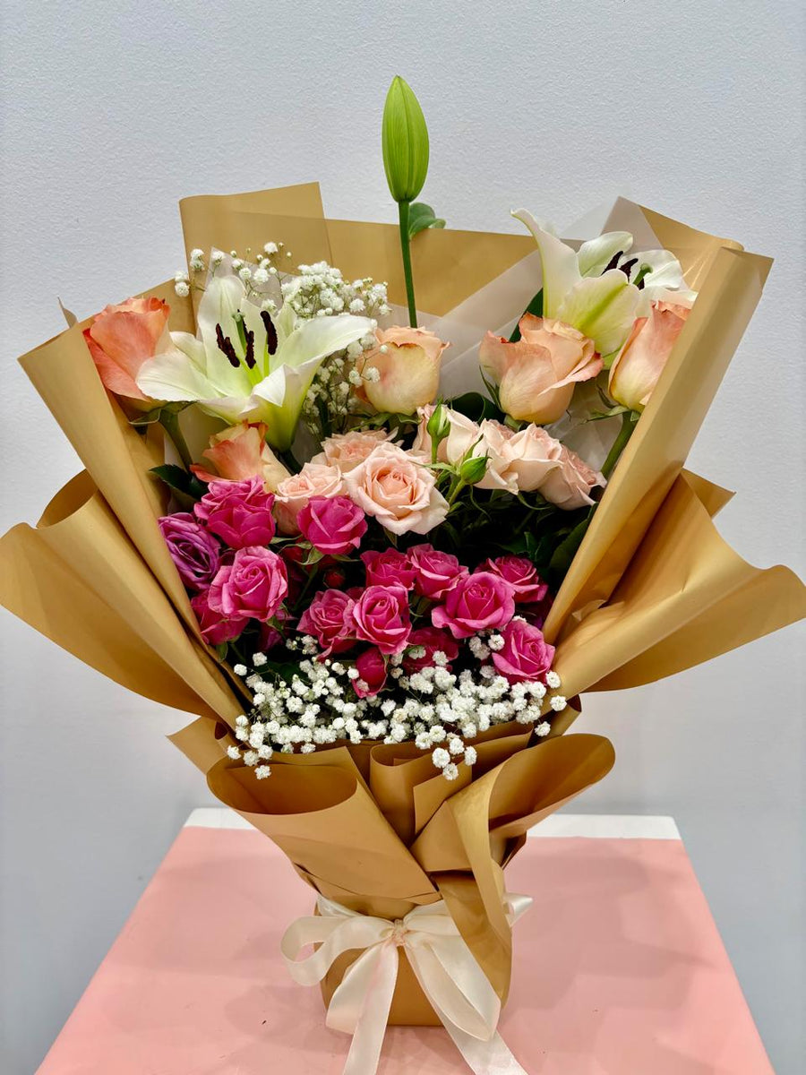 Pink bouquet with gold wrap